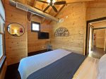 King bedroom two has a Smart TV and overlooks the woods